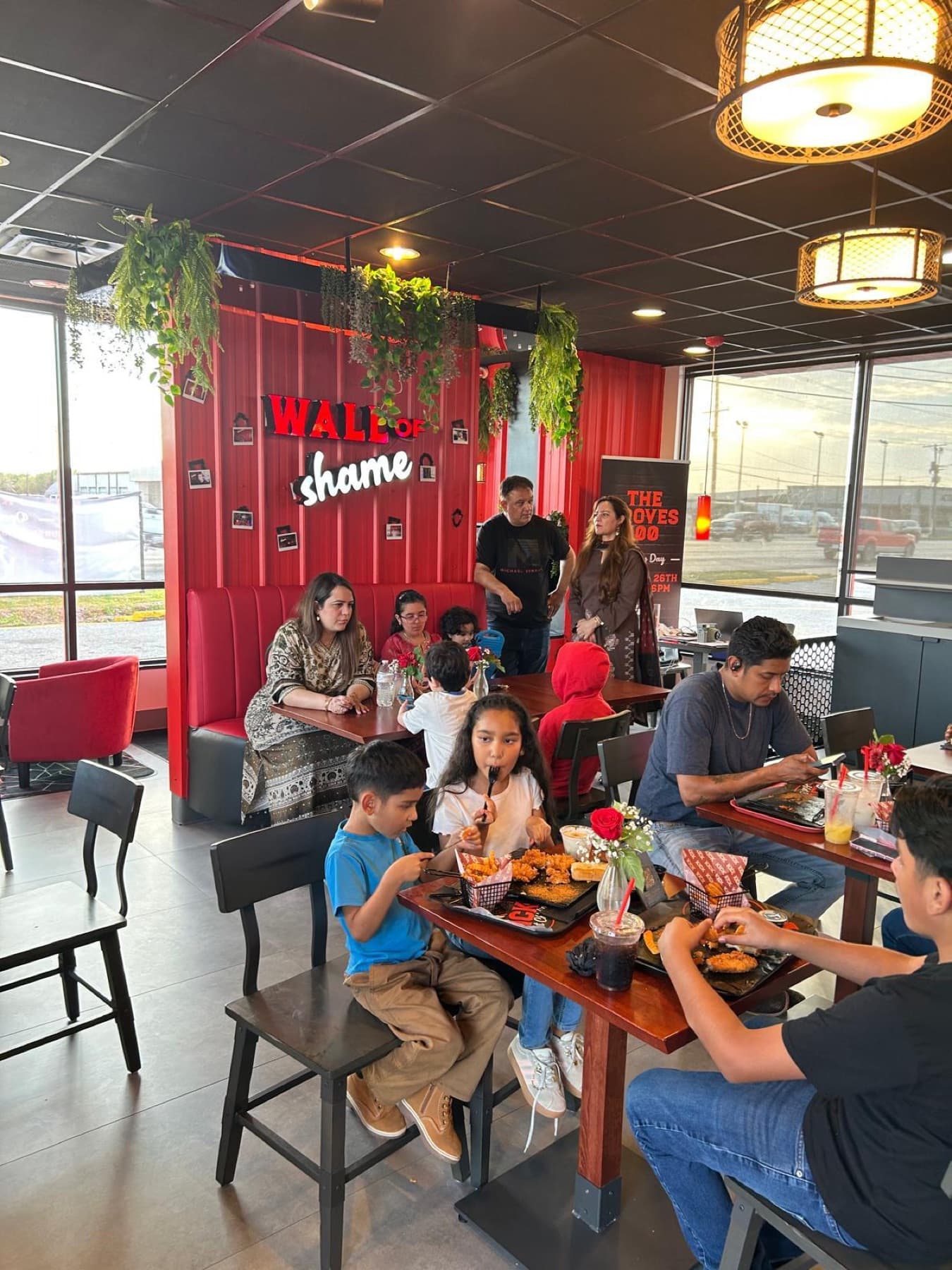 Red booths and the Wall of Shame inside the Groves location